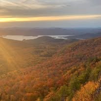 Stunning view overlooking the mountains, landscape and water on one of the High Peaks in the Adirondack Montains.